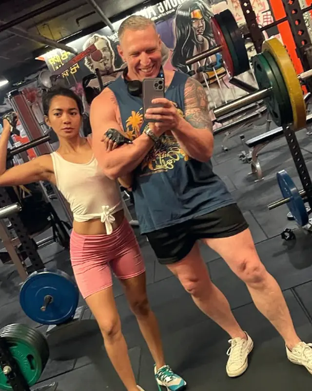 Two LiFT members taking a mirror selfie on the floor
