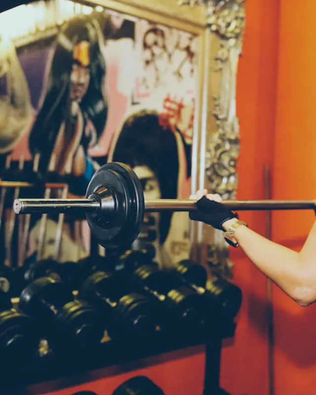 A member lifting at the dumbbell rack
