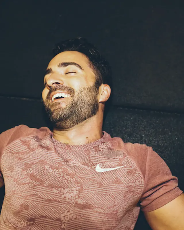 A member laughing between sets