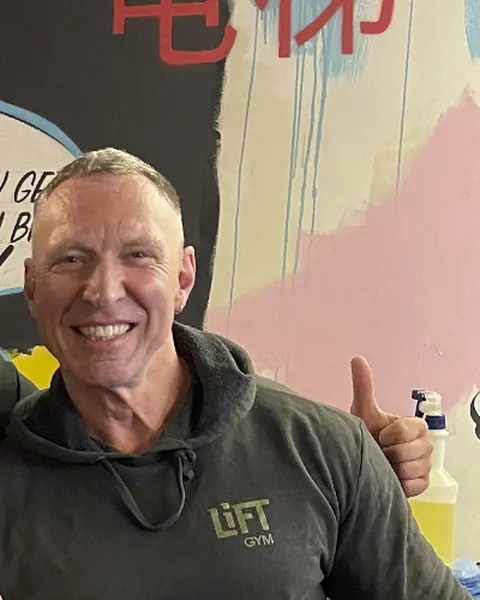 Jo Ralph smiling in a LiFT hoodie