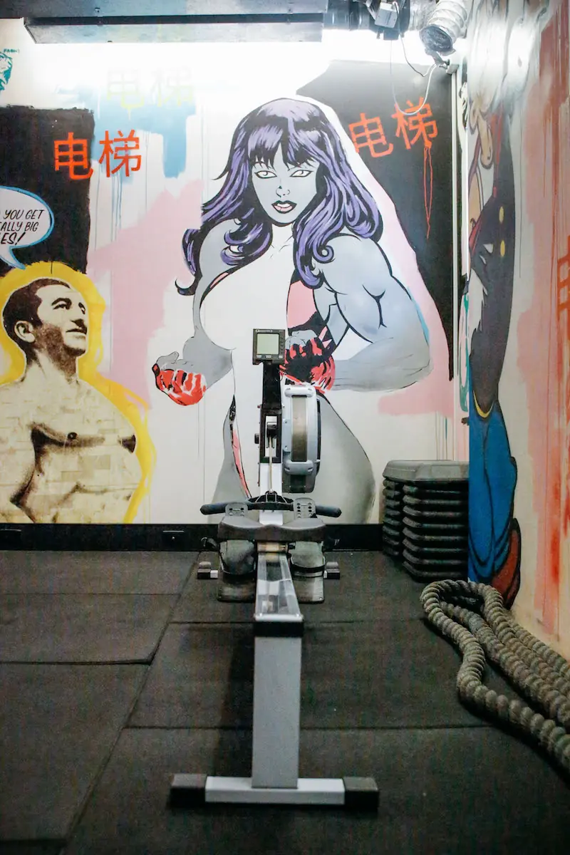 Exercise bike under a comic-style mural