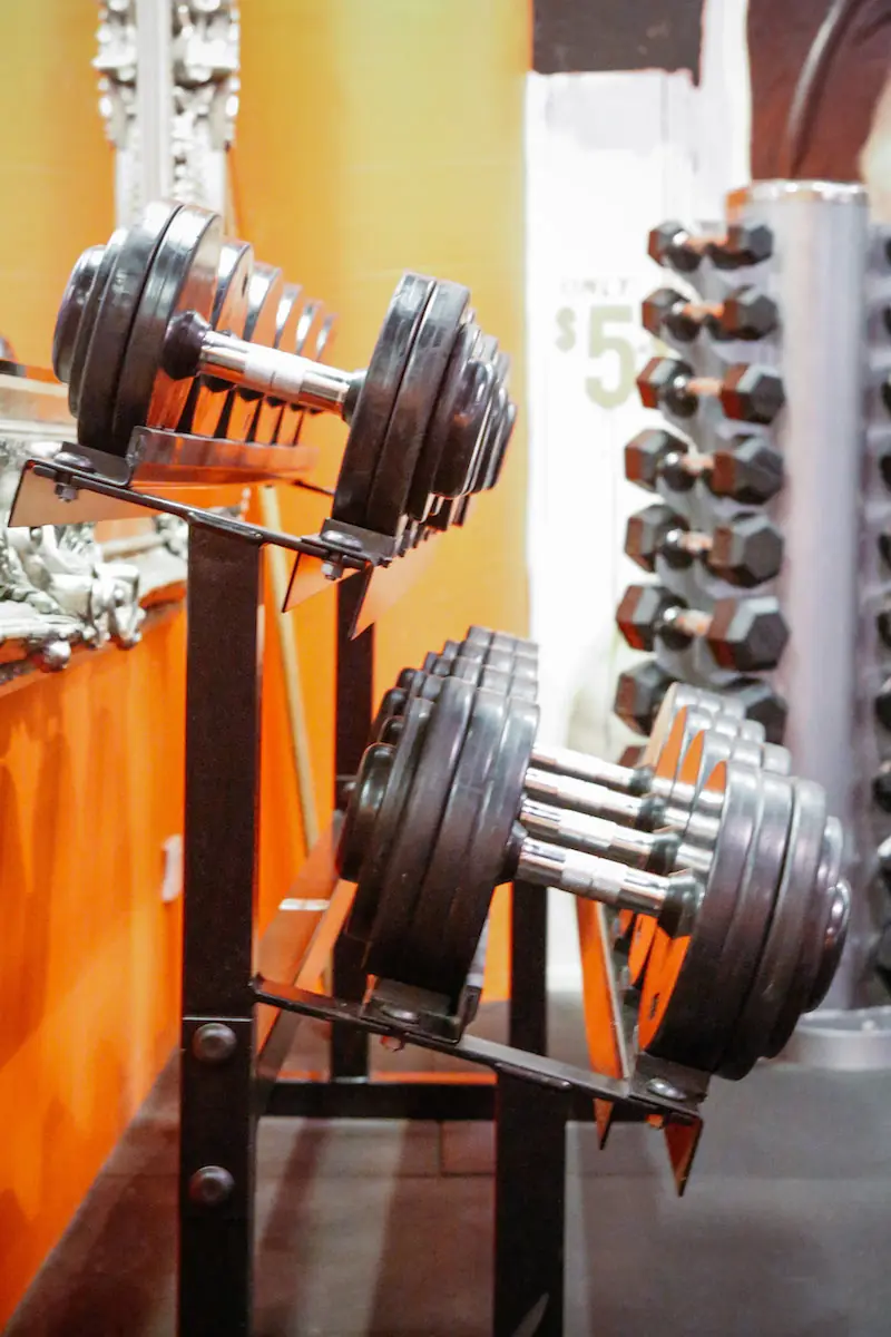 Dumbbell rack against LiFT’s orange wall