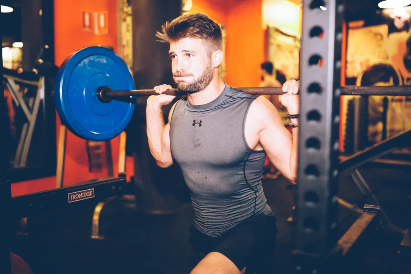 A LiFT member laughing between sets on the gym floor
